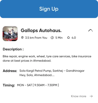 UI component showing a nearby service center with address and open times for two wheeler service app